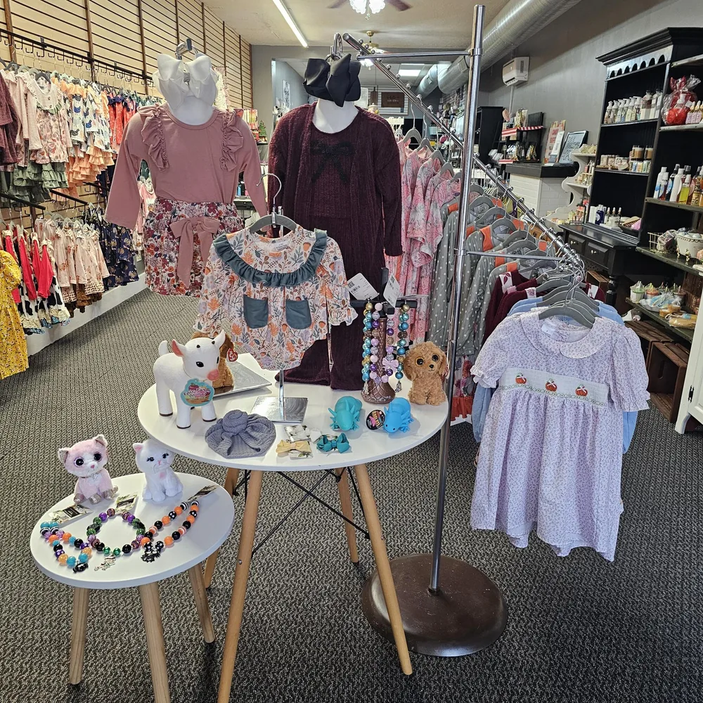 Plush animals, colorful necklaces, toys and children's outfits in the shop