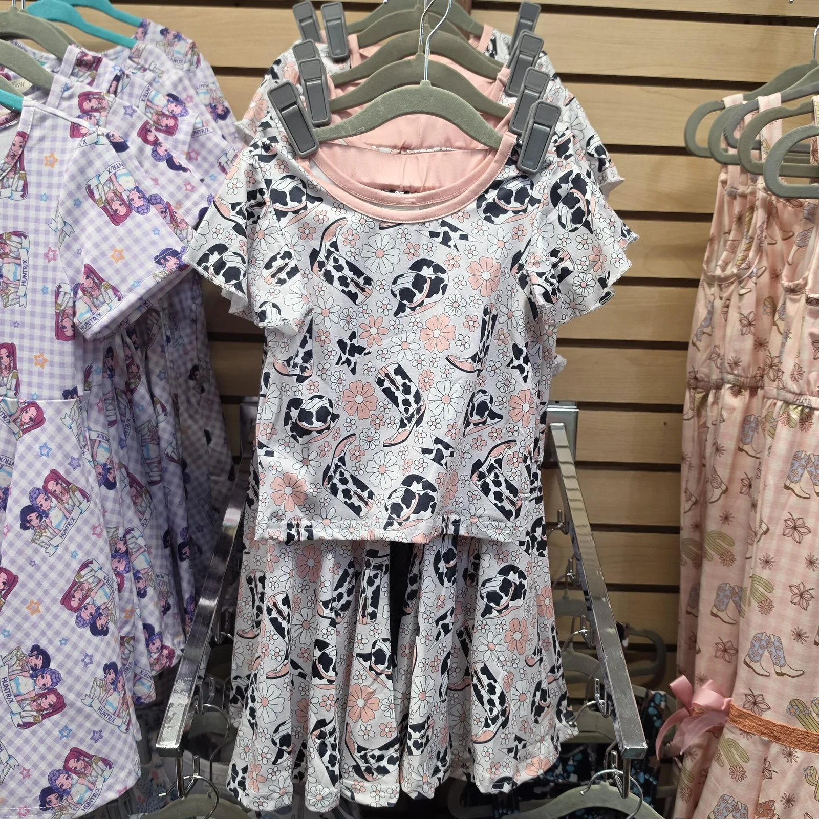 Pink and floral western-style children's outfits on display at Lottie and Lemon
